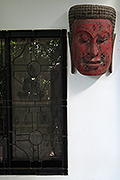 Buddha's mask in teak on the windows:USD580